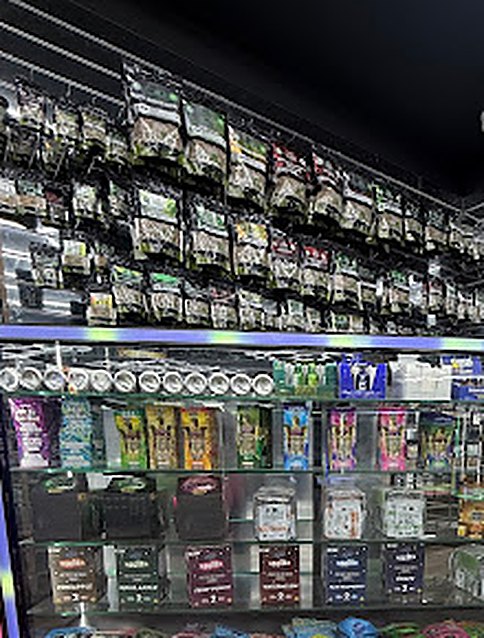 Products hanging on the wall above a display case